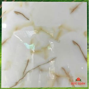 Đá đồng chất siêu bóng kính 800x800 vàng vân cẩm thạch đậm