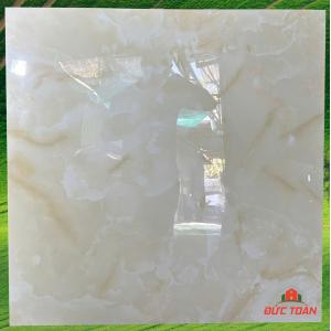 Đá đồng chất siêu bóng kính 80 vân đá cẩm thạch vàng